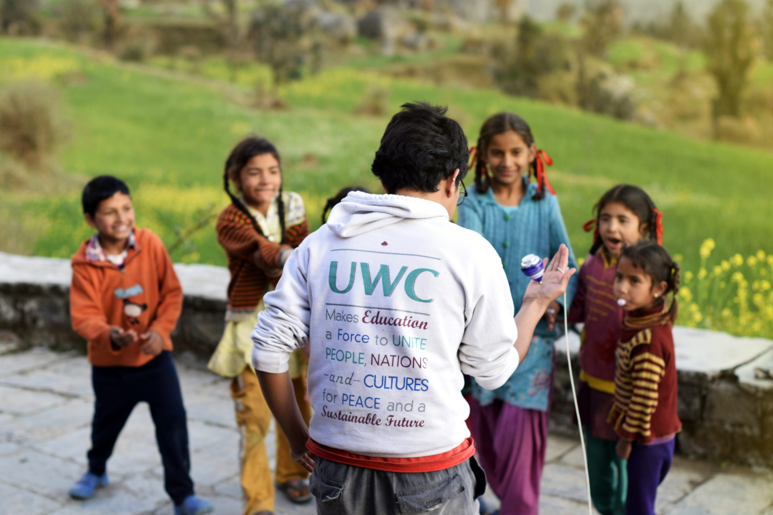 UWC student playing with local children CAS