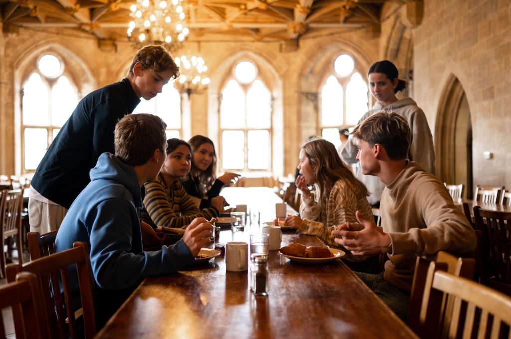 Students sitting around a table having a conversation