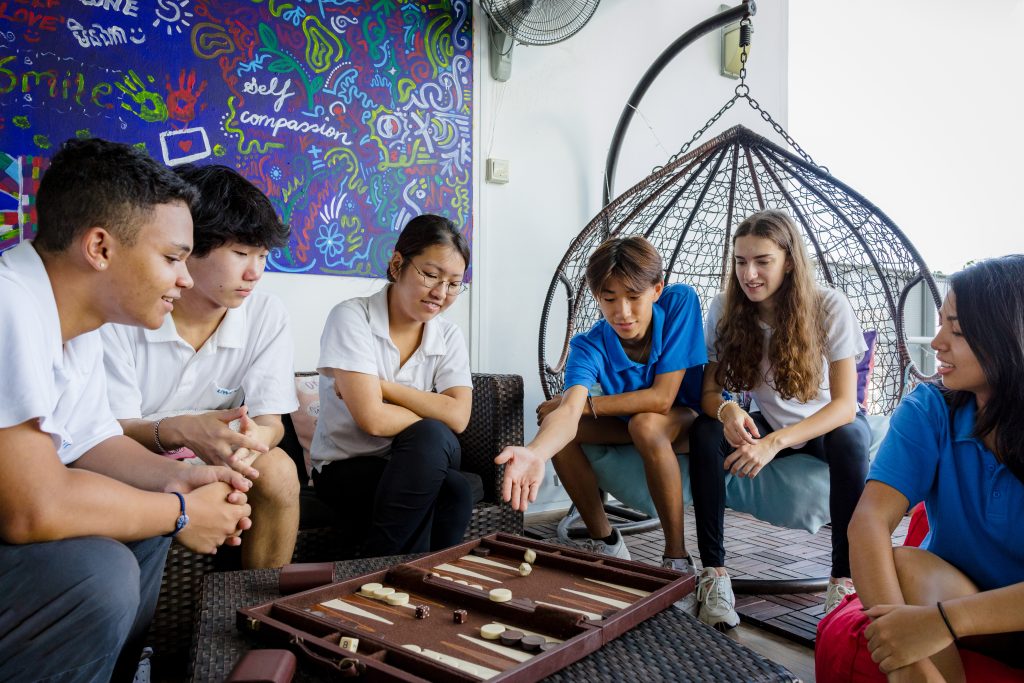 Students playing a board game in residence